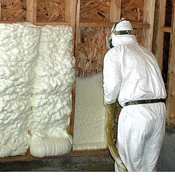 Contractor installng spray foam insulation