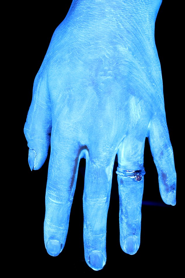 BEFORE WASHING: Covered with germs - shown by the white glow